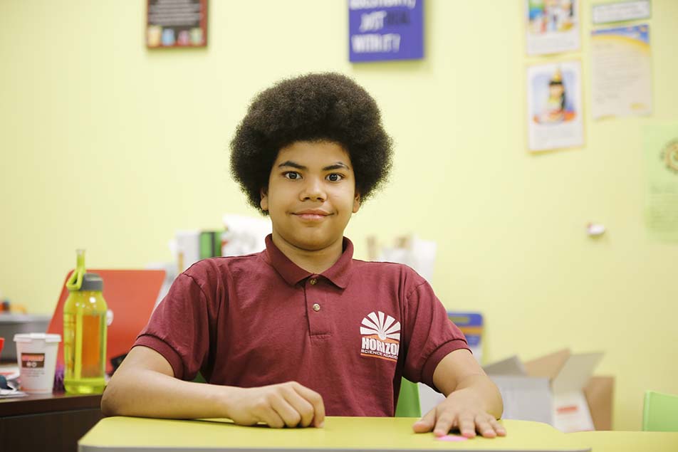 students and teacher working in classroom