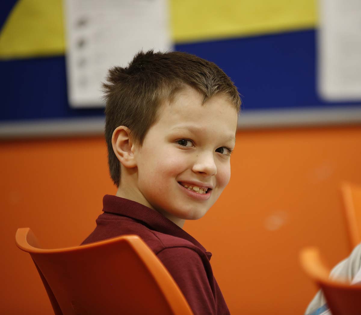 Smiling children together outdoors.